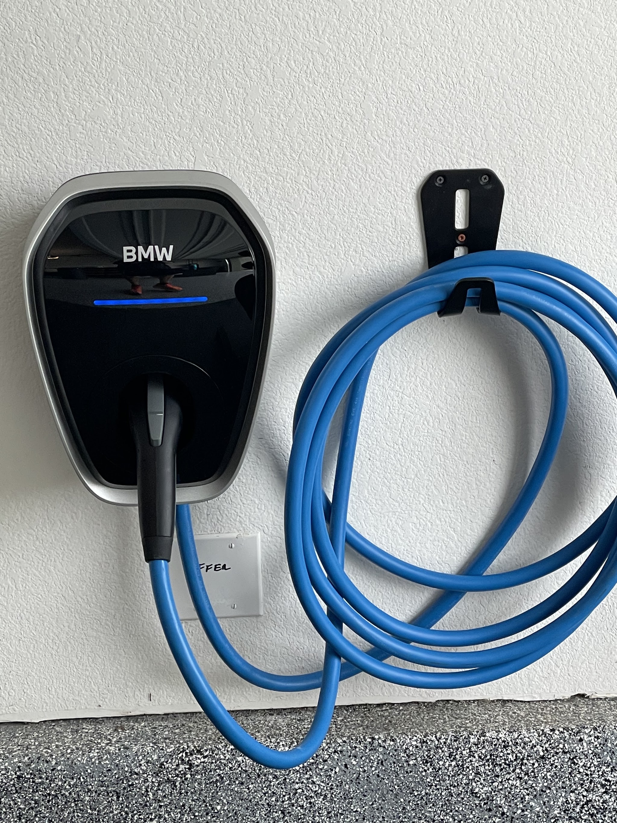 BMW EV wall charger installed in a customer's garage by Nelson Electric
