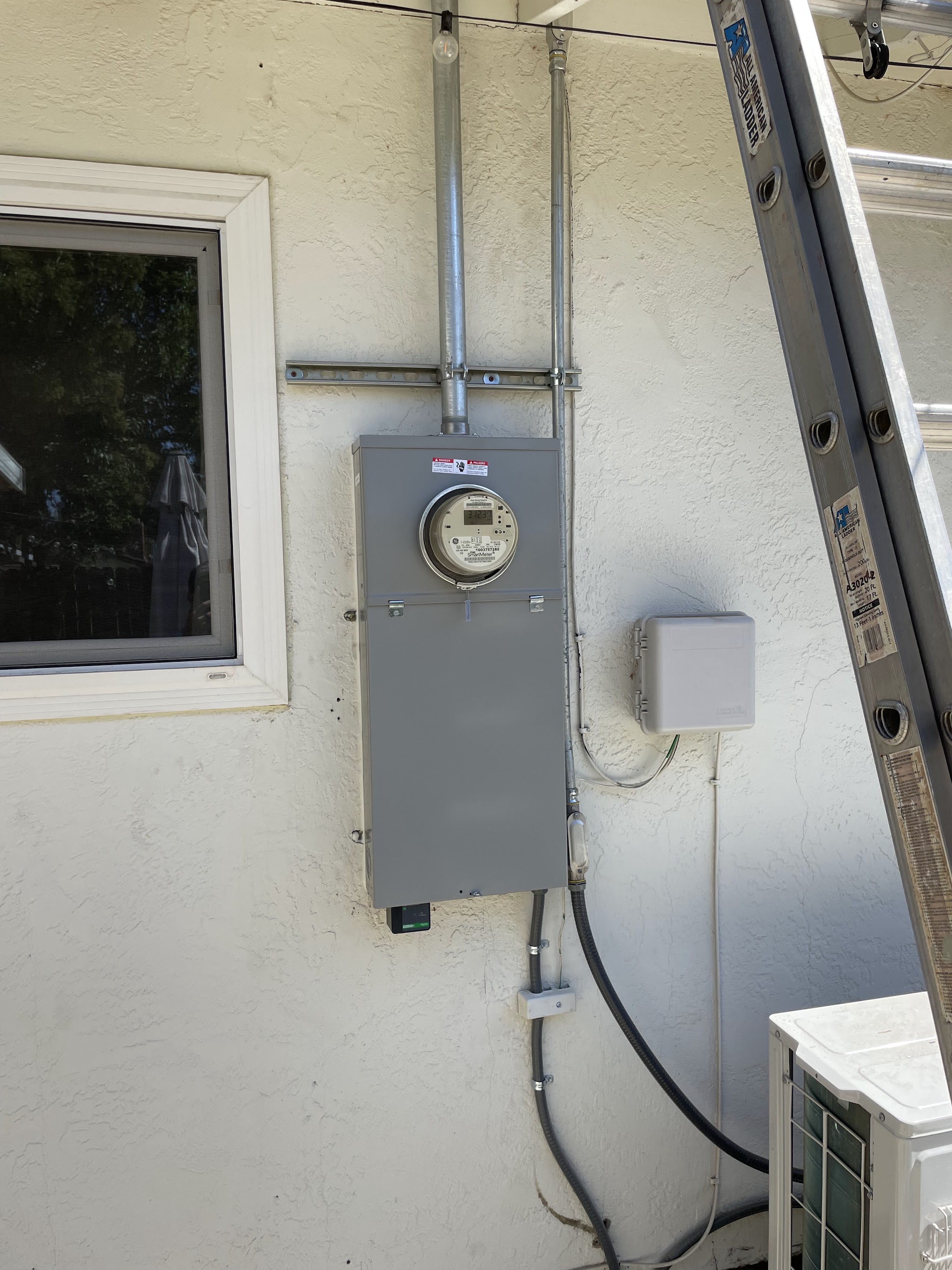 Exterior electrical panel and smart meter installed by Nelson Electric